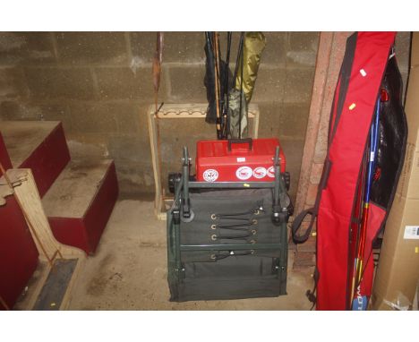 A quantity of fishing equipment to include tool box, fishing box/seat, folding fishing chair, various rods, landing nets etc.