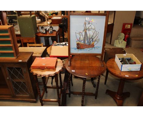 An oak table raised on barley twist supports, an oak pie crust topped table, a folding card table and a fire screen