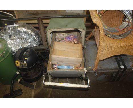 A vintage Silver Cross child's doll's pram with small pine tray and quantity of various dolls