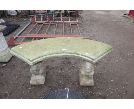 A semi circular concrete garden bench raised on squirrel plinths