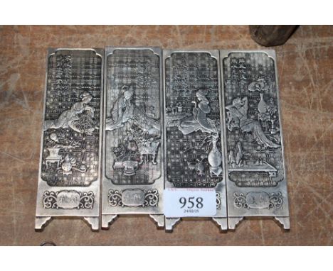 Four reproduction Oriental manuscript weights (64)
