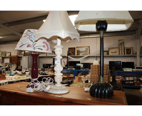 A wooden and brass table lamp and shade together with two other table lamps