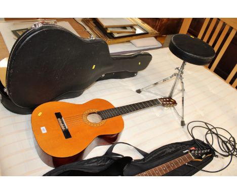 A Hohner Concerta acoustic guitar together with a guitar stool