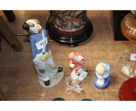 Two Royal Worcester figures 'Sleepy Boy' by M Cane and 'Snow Ball' modelled by F G Doughty, a Swarovski style ornament and a 