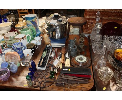A collection of various wooden and meta ware to include an oak cased barometer, stool, wrought iron coat hooks, brass candles