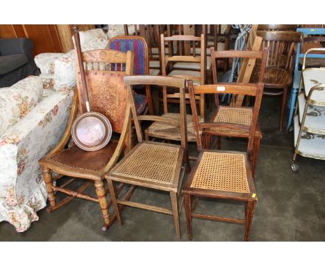 A floral decorated rocking chair, two bar back and string seated dining chairs, a ladder back and string seated dining chair,
