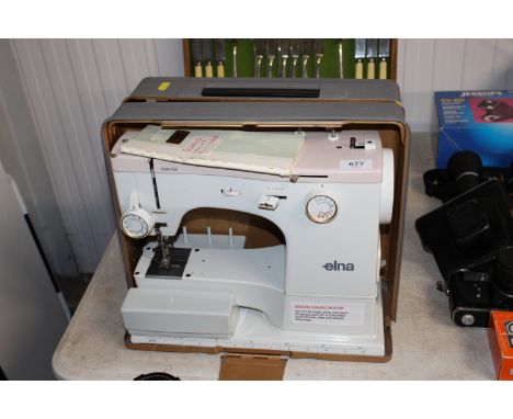An Elna sewing machine in fitted case -sold as a collector's item 