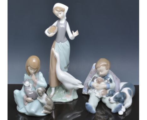 Lladro group of a child with puppies, no. 5456, another no. 1535 and four other Lladro models (6).