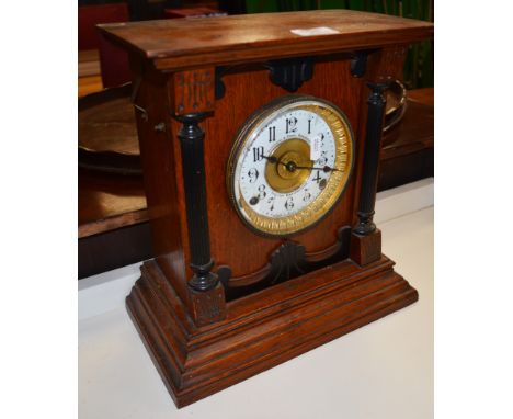 Victorian oak and ebonised mantel clock, gilt dial with enamel chapter ring, signed Fattorini & Sons, Bradford, patent automa