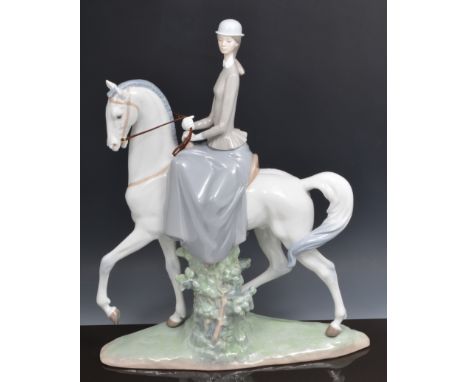 Large Lladro equestrian figure, a young lady riding side saddle, no. D13H, 47cm.