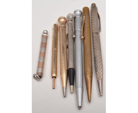 Small yellow metal propelling pencil, marked W Hicks, sterling silver propelling pencil, engine turned and five others (7).