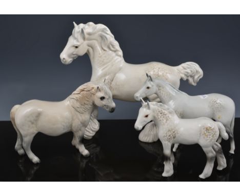 Beswick model of a cantering Shire horse, dappled grey colourway, 22cm and four other horses and ponies in dappled grey (5).