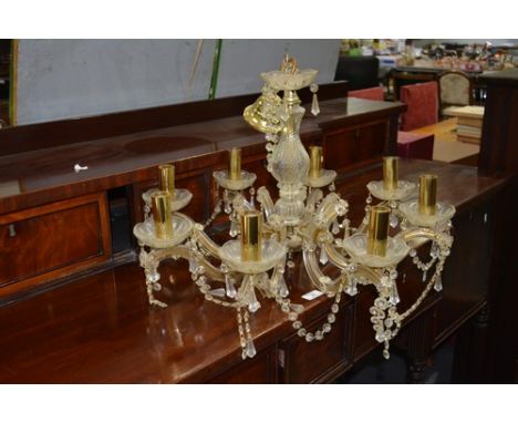Glass eight light chandelier, scrolled branches, faceted drops, diameter 51cm and a similar chandelier (2).