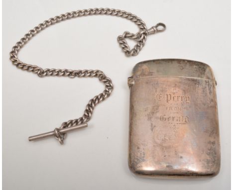 Victorian silver cigarette case, Birmingham 1892, cushion form, engraved, 8cm and a white metal single albert.