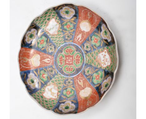 Imari shape circular shallow dish, painted in a typical palette, diameter 22cm, two Imari plates, a jar and other Oriental ce