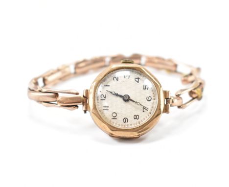 An early 20th Century antique 9ct gold wrist watch. The watch having a round face with arabic numerals to the chapter ring. I