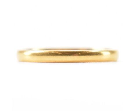 A hallmarked 22ct gold wedding band ring. The ring of plain form. Hallmarked Birmingham 1949. Weight 2.2g. Size K.5.