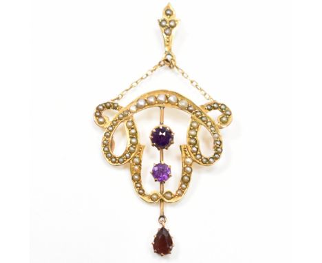 An early 20th Century Art Nouveau amethyst and seed pearl whiplash pendant. The pendant being set with half pearls and two ro