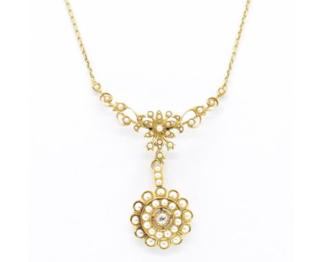An 15ct gold pearl and diamond swag brooch pendant necklace. The necklace strung with a target roundel having a central old c
