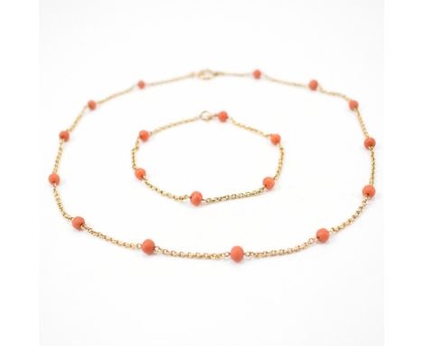 A 19th Century Victorian antique gold and coral necklace and bracelet suite. The suite having an oval link chain threaded wit