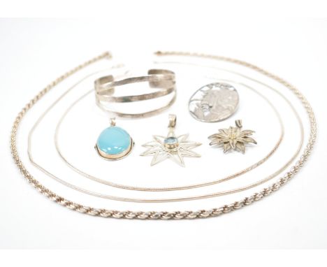 A selection of silver and white metal jewellery. The lot to include a silver rope twist necklace chain (marked 925)a blue sto