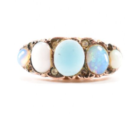 An early 20th Century Edwardian hallmarked 9ct gold and opal ring. The ring being set with four opal cabochons and one blue p