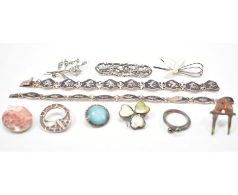 An assortment of silver jewellery to include a silver and enamel niello panel bracelet, a St Ninian Shetland silver roundel b