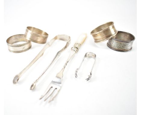 A collection of silver hallmarked flat ware. The lot to include four silver hallmarked napkin rings (hallmarked 1907, 1937 an