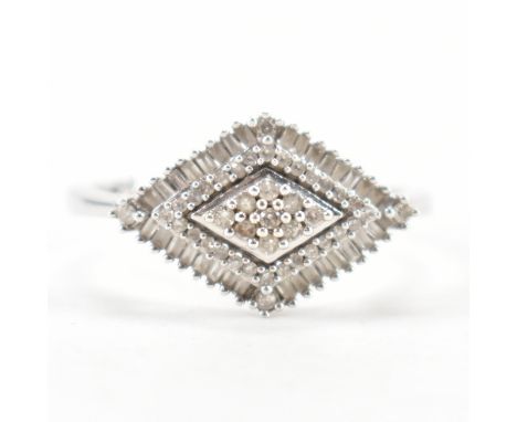 A hallmarked 9ct gold and diamond cluster ring. The ring having a marquise shaped head set with round and rectangular cut dia