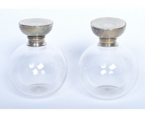 A pair of silver hallmarked cut glass ladies dressing table perfume bottles. Hallmarked for Sheffield 1923 by Martin Hall &am