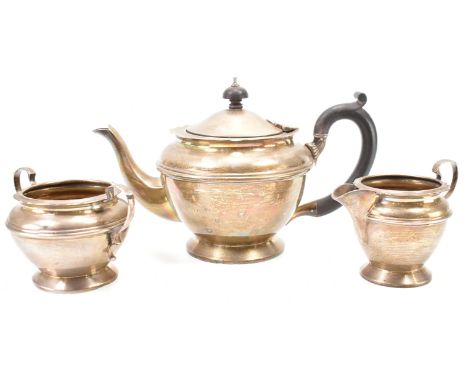 A silver hallmarked tea set by Henry Matthews of Birmingham. The set comprising teapot, creamer jug, and twin handled sugar b