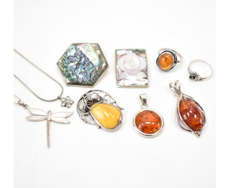 A collection of silver and white metal jewellery. The lot to include a two Mexican alpaca brooch set with shell, two amber se