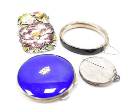 A vintage silver white metal and guilloche enamel compact. The compact having a blue guilloche enamel lid with applied crown 