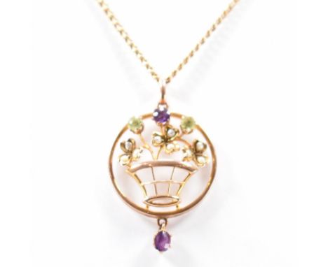 An early 20th Century Edwardian 9ct gold, amethyst, peridot and seed pearl suffragette pendant necklace. The necklace having 