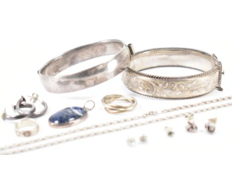 A selection of vintage silver and white metal jewellery. The lot to include two silver hallmarked bangle bracelets (marked fo