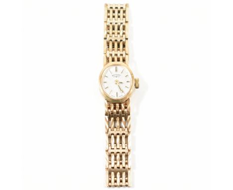 A hallmarked 9ct gold and Rotary wrist watch. The watch having an oval face with baton numerals to the chapter ring. The watc