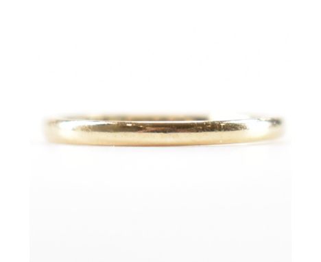 A hallmarked 9ct gold band ring. Assay marked for Birmingham. Date letter T for 1943. Makers marks F.L.R. Ring size M / M.5.T
