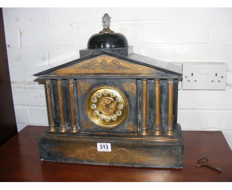 A slate mantle clock with key