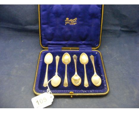 A cased set of silver golfing tea spoons