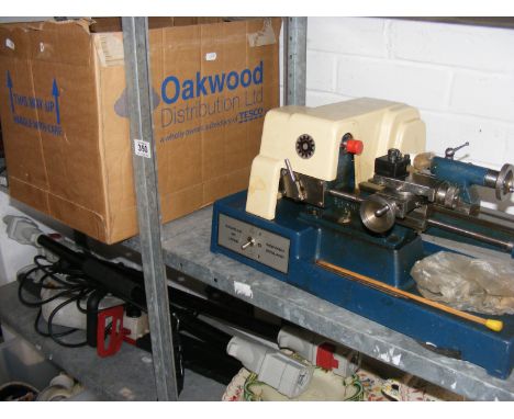 Two small scale lathes together with various accessories