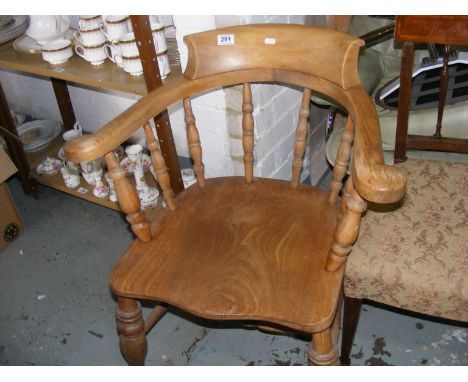 A light wood captain's chair