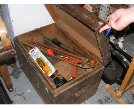 A wooden tool box containing a quantity of hand tools etc.