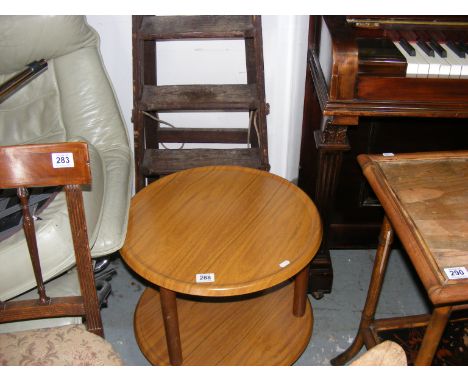 A retro table on castors together with a step ladder