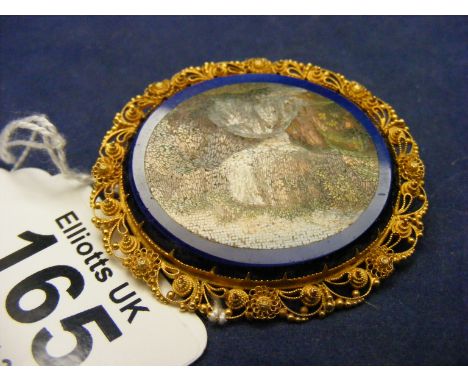 A tested Gold and Enamel brooch depicting a waterfall