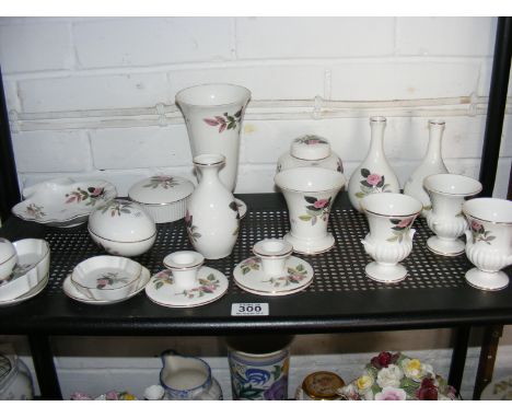 A quantity of Wedgwood Hathaway Rose ceramics to include vases, candlesticks, trinket pots etc.