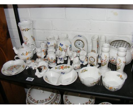 A quantity of Aynsley cottage garden decorative ceramics to include clock, vases, animal trinket pots etc.