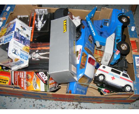 A carton containing a quantity of toys to include Star Wars figures, Solido etc.