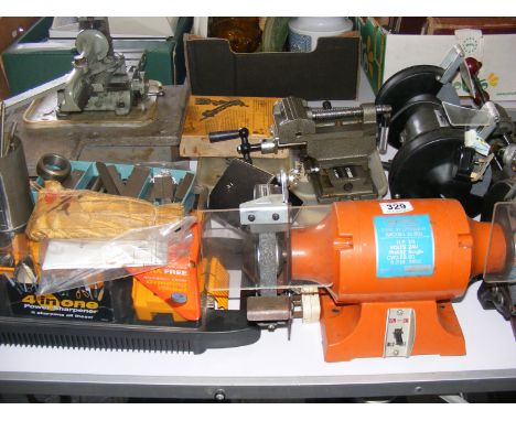 A selection of tools to include bench grinders, vices, drill grinder etc.