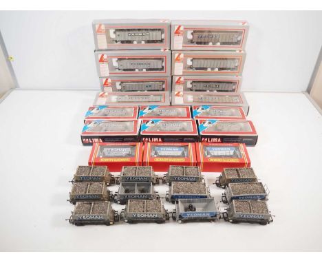 A large group of OO gauge 4 wheel and bogie hopper wagons by LIMA and HORNBY in Yeoman livery - G/VG in G/VG boxes where boxe