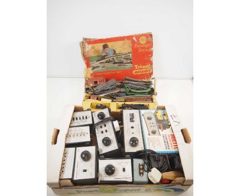 A large quantity of vintage model railway controllers mostly by H&M together with a TRI-ANG train set and accessories (a/f) -